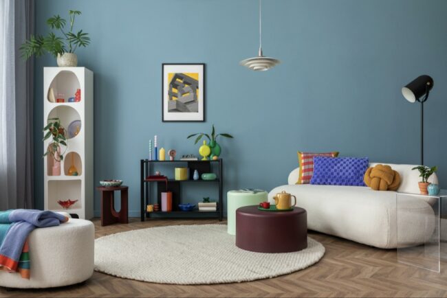 How Do I Mix Bright Colors And Cute Decor To Create A Cheerful Room Design?